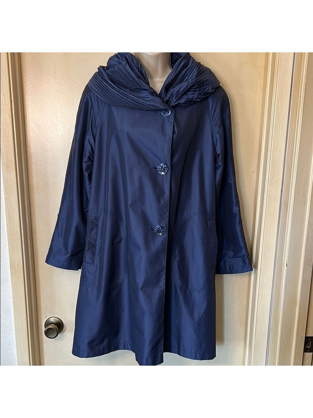 Gallery  Blue Rain Coat with Dramatic Accordion Hood and Water-Resistant Fabric